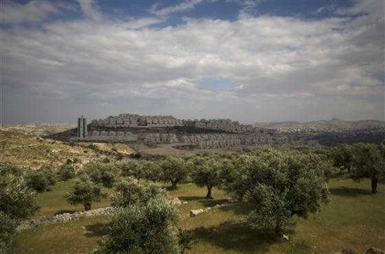 A cloud casts a shadow on the neighborhood of Har Homa in east Jerusalem on Thursday. Aides to Israel's prime minister say he has officially rejected President Barack Obama’s demand to suspend all construction in the contested area.